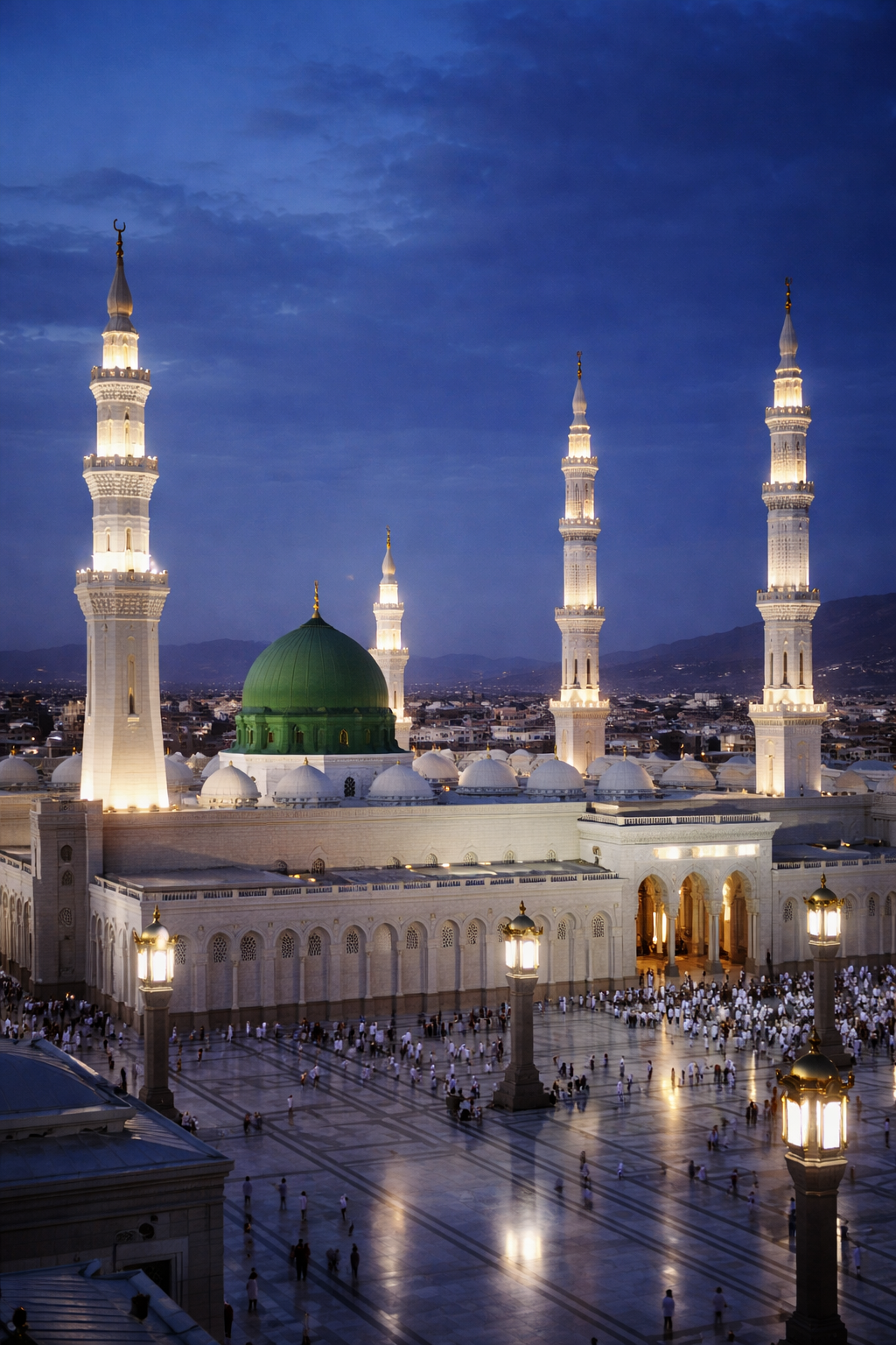 Masjid an-Nabawi Prophet's Mosque in Medina with iconic Green Dome prominently visible, white mosque architecture and minarets illuminated at twilight -- blue and green palette sacred atmosphere HD wallpaper
